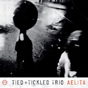 A Rocket Debris Cloud Drifts by Tied & Tickled Trio