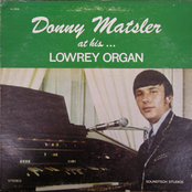 at his… Lowrey Organ