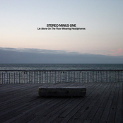 Lie Alone on the Floor Wearing Headphones