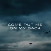 On my back