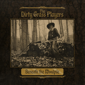 The Dirty Grass Players: Beneath the Woodpile