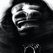 I LIE HERE BURIED WITH MY RINGS AND MY DRESSES