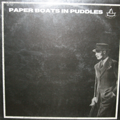 paper boats in puddles