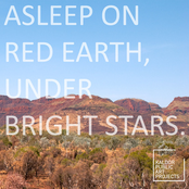 Asleep on red earth, under bright stars.