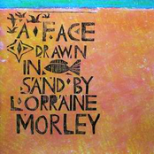 A Face Drawn In The Sand