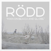 Man On Beach and Globe