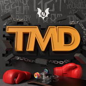 T M D