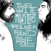 Two White Monsters Around A Round Table