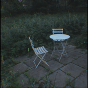 Two Foldable metal chairs and A Foldable metal table