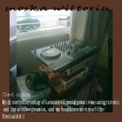 the DJ is doing things with the turnttables at live event with the sky turnin red