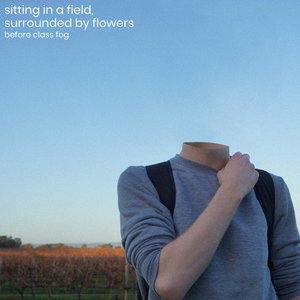 Sitting in a Field, Surrounded by Flowers