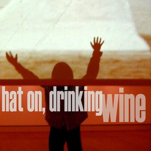 Hat on, Drinking Wine