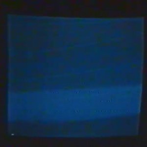 self-concealed within a dark room