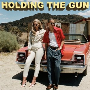 Holding The Gun
