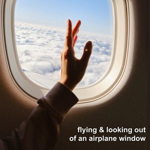 flying & looking out of an airplane window