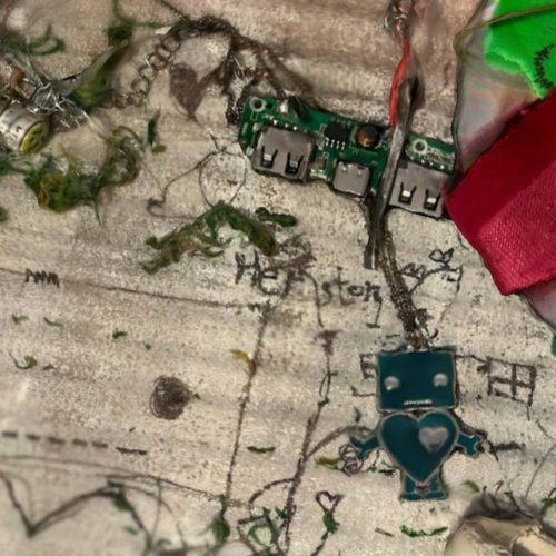 At the road sign there is a cross on a green thread