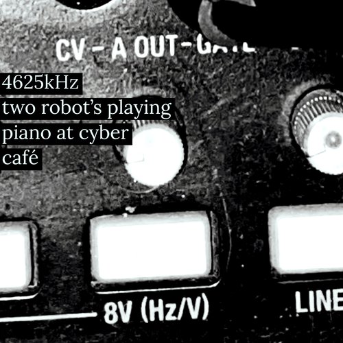Two Robot's playing piano at Cyber Café