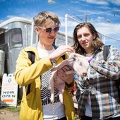 Drenge brothers stroke piglet