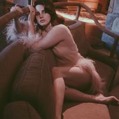 Lana Del Rey, Gorgeous on Couch, Beautifully Forlorn Gaze