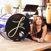 Liv Devine with her backing bands drums