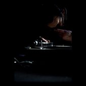 Jules Deelder playing a record