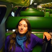 ayla on a green train