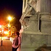 thinking under the statue of wisdom
