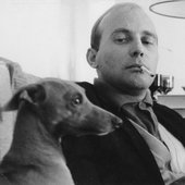 Henze smoking with his dog