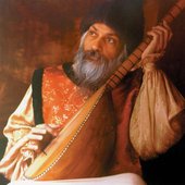 Osho with instrument