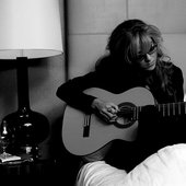 Playing guitar in the hotel