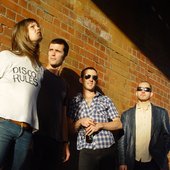 Fiona Kitschin in DISCO RULES t-shirt with her band The Drones.