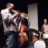 Federico Ughi with William Parker and Daniel Carter playing at The Stone in New York in 2006