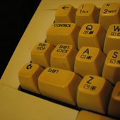 Shift + Run/Stop keys on C64 keyboard