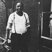 Teddy Darby in front of his East St. Louis home. Photo by Diane Allmen