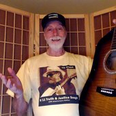 Vic Sadot wearing his \"9/11Truth & Justice Songs\" CD cover T-shirt