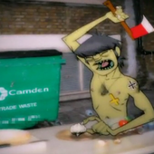 Murdoc cutting an onion