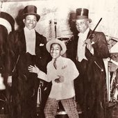 The Will Mastin Trio, featuring Will Mastin, Sammy Davis Sr., and a nine-year-old Sammy David Jr.