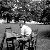 He plays the hammered dulcimer by striking it with sticks.jpg