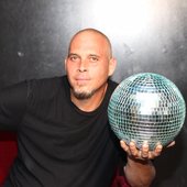 Tyler Hill holding a disco ball