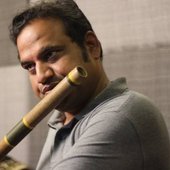 Ramachandra playing flute