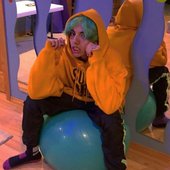 jumex sitting on a bouncy ball