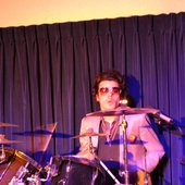 Erik M Shultz as \"The Drummer\"
