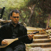 playing the kopuz