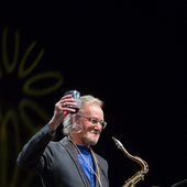 John holding up a glass