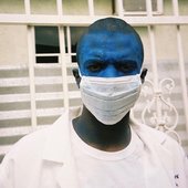 Ameer with blue face paint and doctor's mask