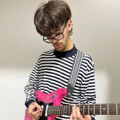 LoveSkars playing guitar