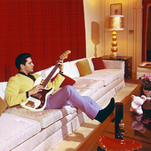 Elvis playing bass guitar at Graceland