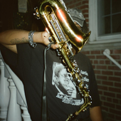 man plays the saxophone