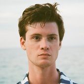 Alex Frew intensely stare into the distance