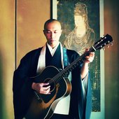 Kanho Yakushiji with guitar